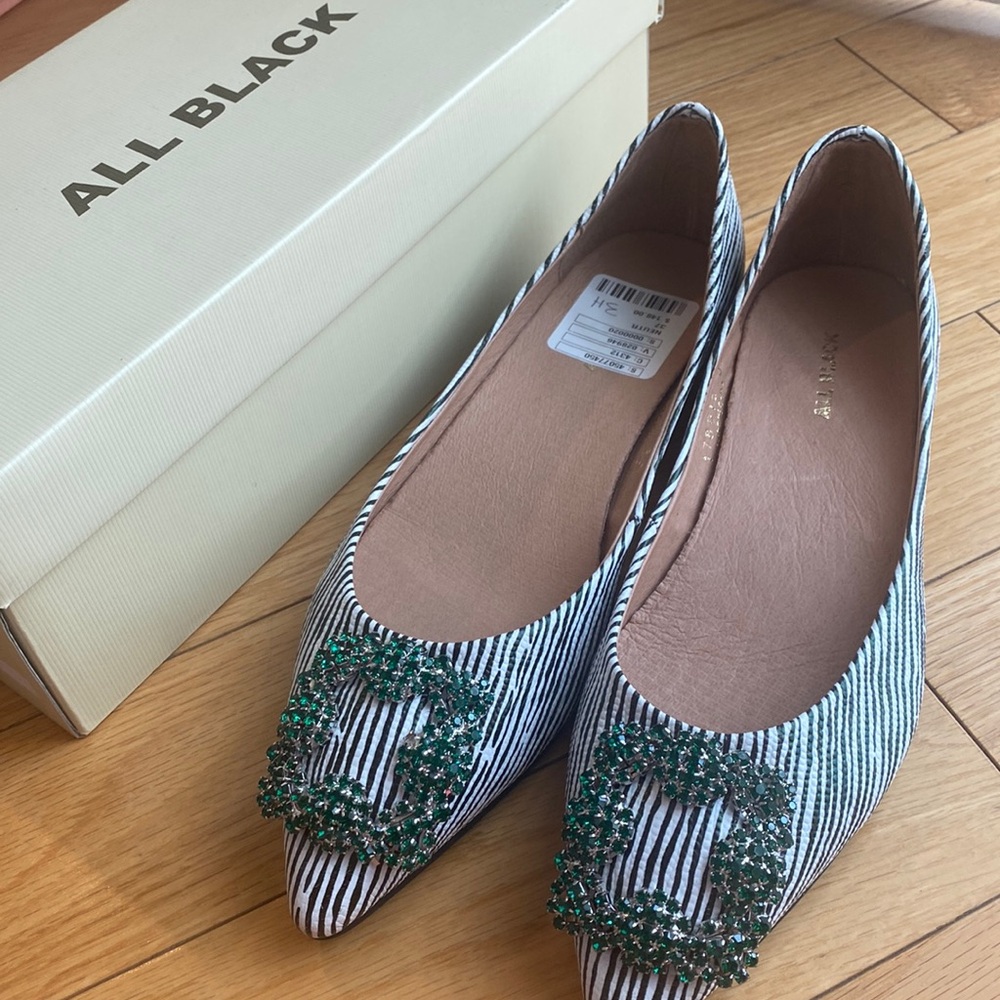 All Black flats striped black/white green buckle